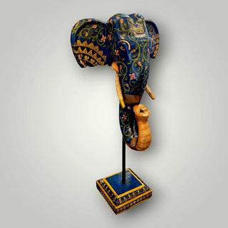 Wooden blue elephant trunk on stand