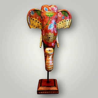 Wooden orange elephant trunk on stand